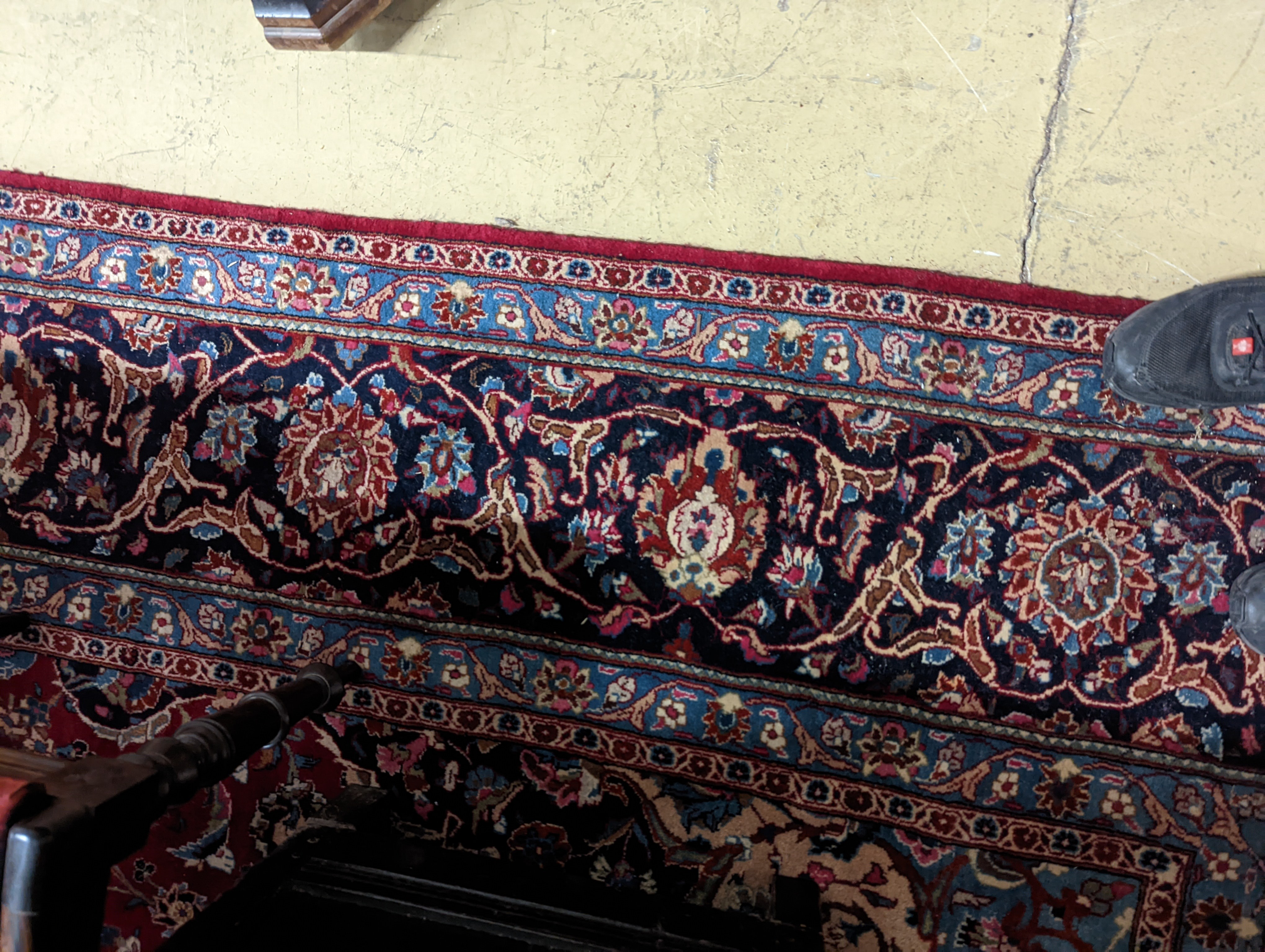 A Kashan burgundy ground carpet, 380 x 300cm